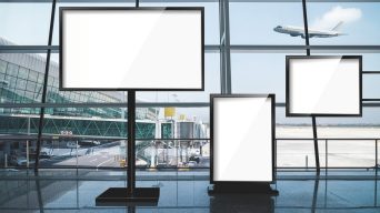 blank advertising light box on modern airport terminal